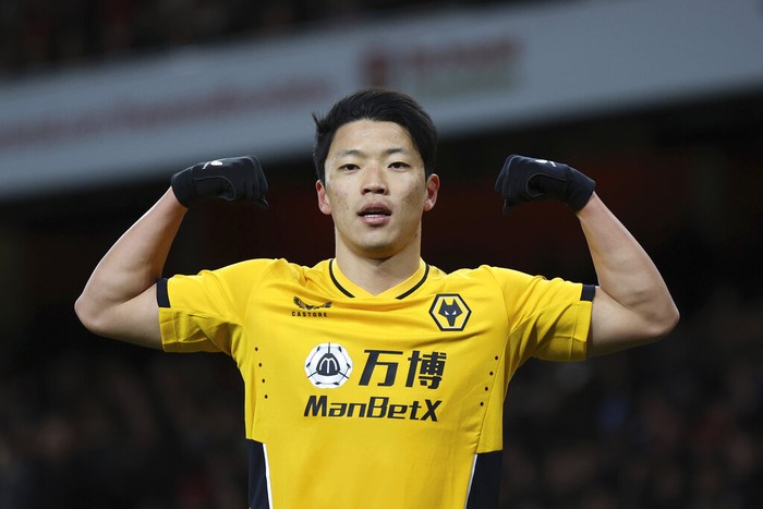 Wolverhampton Wanderers' Hwang Hee-chan celebrates after scoring his side's opening goal during the English Premier League soccer match between Wolverhampton and Liverpool at the Molineux stadium in Wolverhampton, England, Saturday, Sept. 16, 2023. (AP Photo/Rui Vieira)