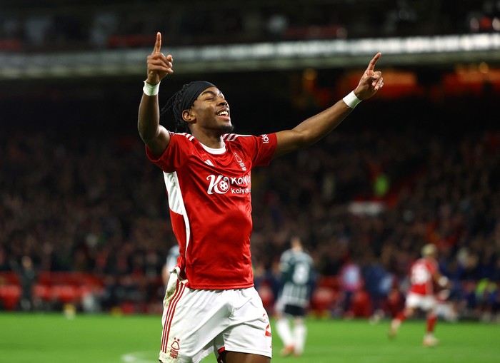 Soccer Football - Premier League - Nottingham Forest v Manchester United - The City Ground, Nottingham, Britain - December 30, 2023  Nottingham Forests Anthony Elanga celebrates their first goal scored by Nicolas Dominguez REUTERS/Molly Darlington NO USE WITH UNAUTHORIZED AUDIO, VIDEO, DATA, FIXTURE LISTS, CLUB/LEAGUE LOGOS OR LIVE SERVICES. ONLINE IN-MATCH USE LIMITED TO 45 IMAGES, NO VIDEO EMULATION. NO USE IN BETTING, GAMES OR SINGLE CLUB/LEAGUE/PLAYER PUBLICATIONS.