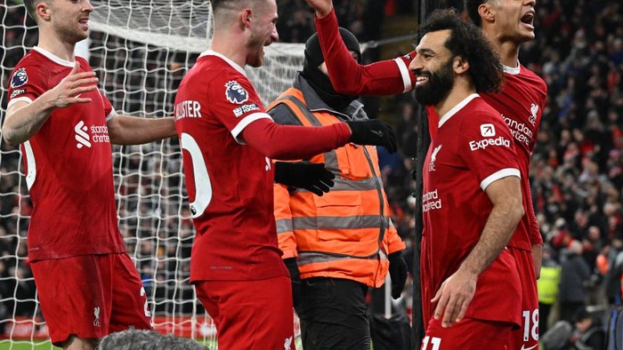 LIVERPOOL, ENGLAND - JANUARY 01:(THE SUN OUT. THE SUN ON SUNDAY OUT) Mohamed Salah of Liverpool celebrates after scoring the fourth Liverpool goal during the Premier League match between Liverpool FC and Newcastle United at Anfield on January 01, 2024 in Liverpool, England. (Photo by John Powell/Liverpool FC via Getty Images)