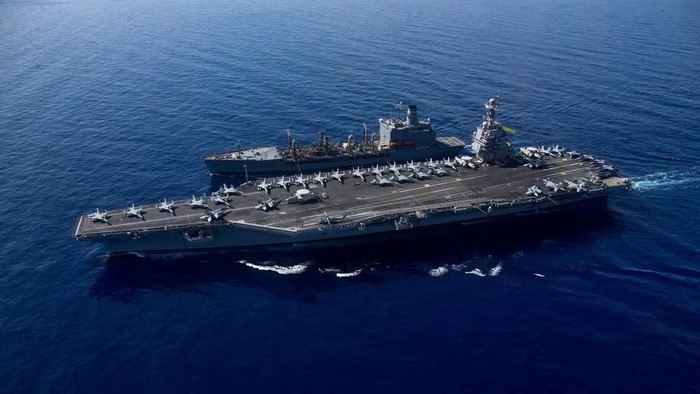 Kapal induk AS USS Gerald R Ford The worlds largest aircraft carrier USS Gerald R. Ford steams alongside USNS Laramie (T-AO-203) during a fueling-at-sea in the eastern Mediterranean Sea, as a scheduled deployment in the U.S Naval Forces Europe area of operations, deployed by U.S. Sixth Fleet to defend U.S, allied, and partners interests, in this photo taken on October, 11, 2023 and released by U.S. Navy on October 14, 2023. U.S Naval Forces Central Command / U.S. 6th Fleet / Handout via REUTERS/File Photo Acquire Licensing Rights