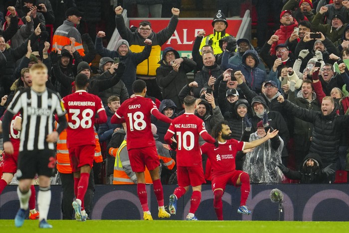 Liverpool Liverpool's Mohamed Salah, right, celebrates with teammates after scoring his side's fourth goal during the English Premier League soccer match between Liverpool and Newcastle, at Anfield stadium in Liverpool, England, Monday, Jan. 1, 2024. (AP Photo/Jon Super)