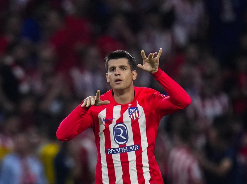 Atletico Madrid's Alvaro Morata celebrates after scoring his side's third goal during the Spanish La Liga soccer match between Atletico Madrid and Real Madrid at Metropolitan stadium in Madrid, Sunday, Sept. 24, 2023. (AP Photo/Manu Fernandez)