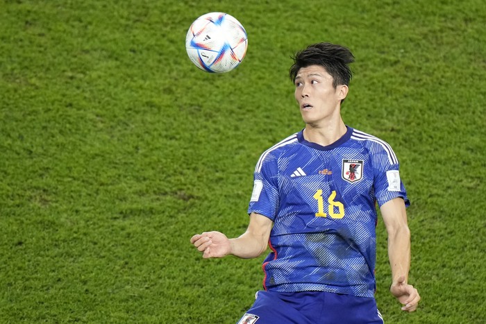 Japans Takehiro Tomiyasu heads the ball during the World Cup round of 16 soccer match between Japan and Croatia at the Al Janoub Stadium in Al Wakrah, Qatar, Monday, Dec. 5, 2022. (AP Photo/Luca Bruno)
