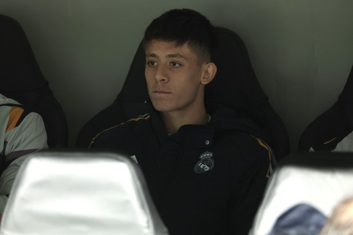 Real Madrids Turkish midfielder #24 Arda Guler watches from the bench the UEFA Champions League group C football match between Real Madrid CF and SC Braga at the Santiago Bernabeu stadium in Madrid on November 8, 2023. (Photo by Thomas COEX / AFP)