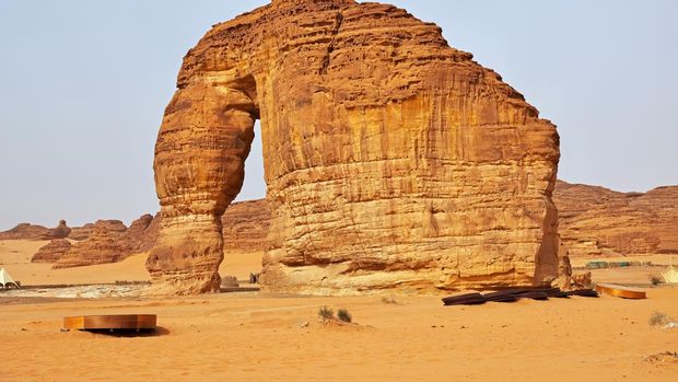 Buses are parked at different places in the desert to take tourists to different places during the day in Al-Ula, Saudi Arabia.