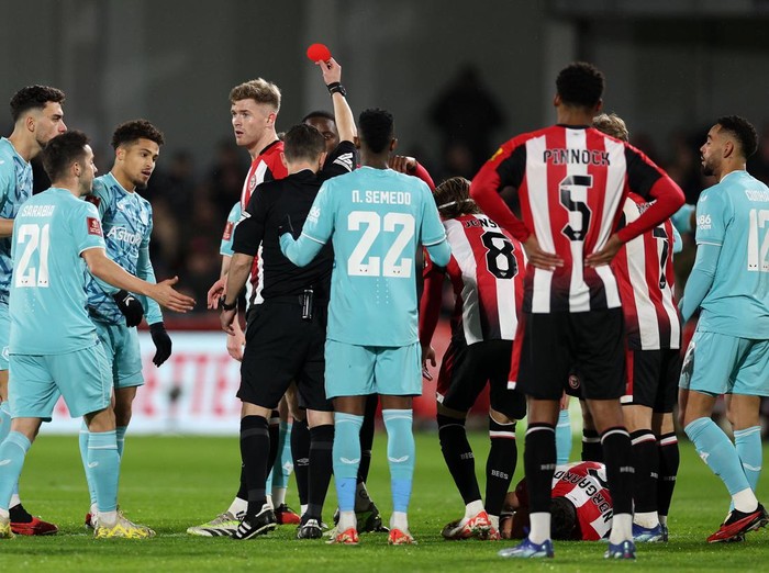 BRENTFORD, ENGLAND - JANUARY 05: Joao Gomes of Wolverhampton Wanderers is shown a red card by Referee Tony Harrington during the Emirates FA Cup Third Round match between Brentford and Wolverhampton Wanderers at Gtech Community Stadium on January 05, 2024 in Brentford, England. (Photo by Warren Little/Getty Images)