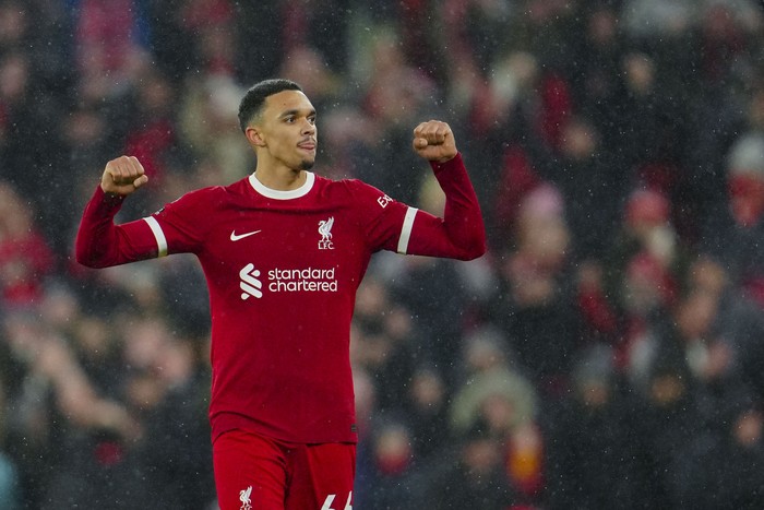 Liverpool's Trent Alexander-Arnold celebrates at the end of the English Premier League soccer match between Liverpool and Newcastle, at Anfield stadium in Liverpool, England, Monday, Jan. 1, 2024. (AP Photo/Jon Super)