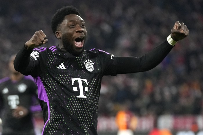 Bayerns Alphonso Davies celebrates after Harry Kane scored the opening goal with Thomas Mueller, right, and Konrad Laimer during the Champions League group A soccer match between Bayer Munich and Galatasaray at the Allianz Arena stadium in Munich, Germany, Wednesday, Nov. 8, 2023. (AP Photo/Matthias Schrader)