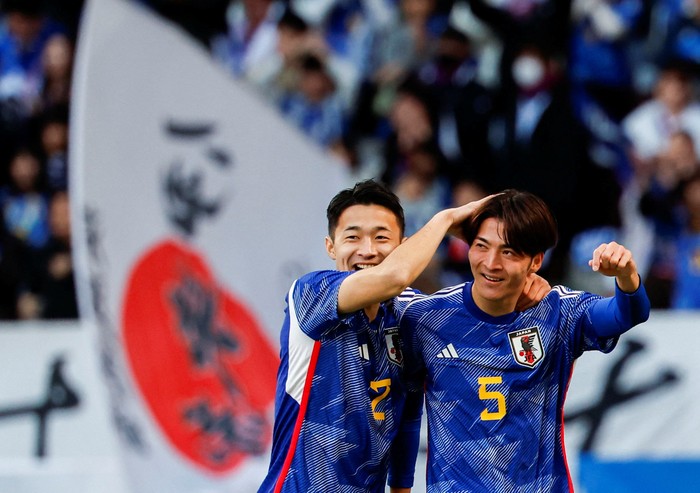 Soccer Football - International friendly - Japan v Thailand - Japan National Stadium, Tokyo, Japan - January 1, 2024.   Japans Takumu Kawamura celebrates with Yukinari Sugiyama after scoring a goal. REUTERS/Issei Kato