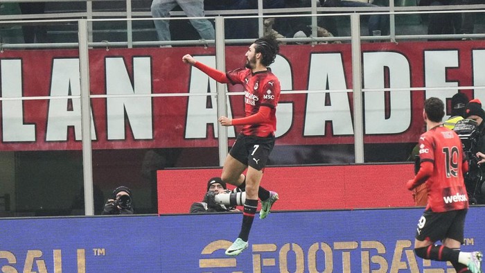AC Milans Yacine Adli celebrates after scoring the opening goal during a Serie A soccer match between AC Milan and Roma at the San Siro stadium in Milan, Italy, Sunday, Jan. 14, 2024. (AP Photo/Luca Bruno)