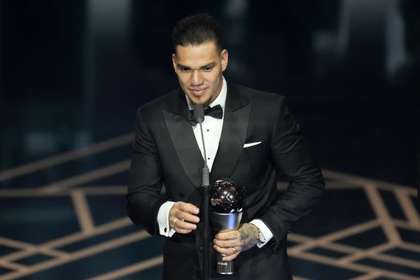 Manchester Citys and Brazils goalkeeper Ederson accepts the Best Mens Goalkeeper award during the FIFA Football Awards 2023 at the Eventim Apollo in Hammersmith, London, Monday, Jan. 15, 2024. (AP Photo/Kirsty Wigglesworth)