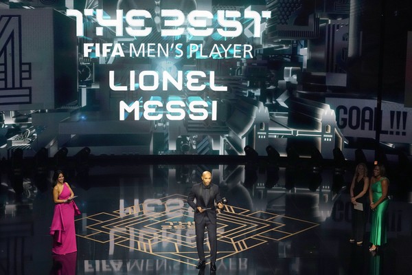 Former France soccer player Thierry Henry accepts on behalf of Argentinas Lionel Messi the Best Mens Player award during the FIFA Football Awards 2023 at the Eventim Apollo in Hammersmith, London, Monday, Jan. 15, 2024. (AP Photo/Kirsty Wigglesworth)