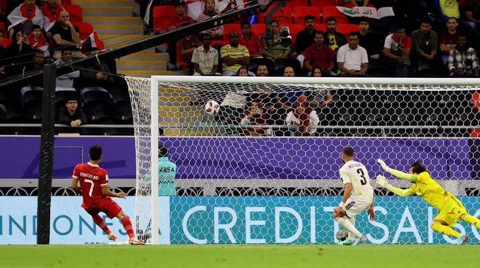 Soccer Football - AFC Asian Cup - Group D - Indonesia v Iraq - Ahmad bin Ali Stadium, Al Rayyan, Qatar - January 15, 2024 Indonesias Marselino Ferdinan scores their first goal REUTERS/Ibraheem Al Omari
