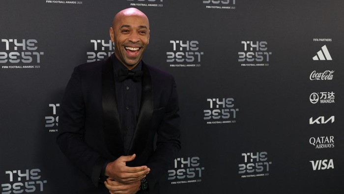 Former France International Thierry Henry smiles upon arrival to attend the Best FIFA Football Awards 2023 ceremony in London on January 15, 2024. (Photo by Adrian DENNIS / AFP)