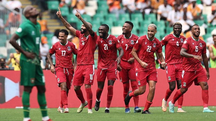 Equatorial Guineas forward #10 Emilio Nsue (3L) celebrates with teammates after scoring his teams fourth goal during the Africa Cup of Nations (CAN) 2024 group A football match between Equatorial Guinea and Guinea-Bissau at the Alassane Ouattara Olympic Stadium in Ebimpe, Abidjan, on January 18, 2024. (Photo by FRANCK FIFE / AFP)