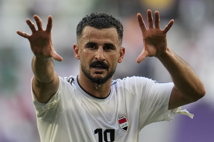 Iraqs Aymen Hussein celebrates after scoring his sides second goal during the Asian Cup Group C soccer match between Iraq and Japan at the Education City Stadium in Al Rayyan, Qatar, Friday, Jan. 19, 2024. (AP Photo/Aijaz Rahi)