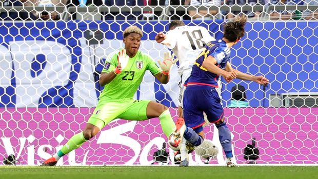 Iraq's forward #18 Aymen Hussein scores his team's second goal past Japan's goalkeeper #23 Zion Suzuki during the Qatar 2023 AFC Asian Cup Group D football match between Iraq and Japan at the Education City Stadium in Al-Rayyan, west of Doha on January 19, 2024. (Photo by Giuseppe CACACE / AFP)