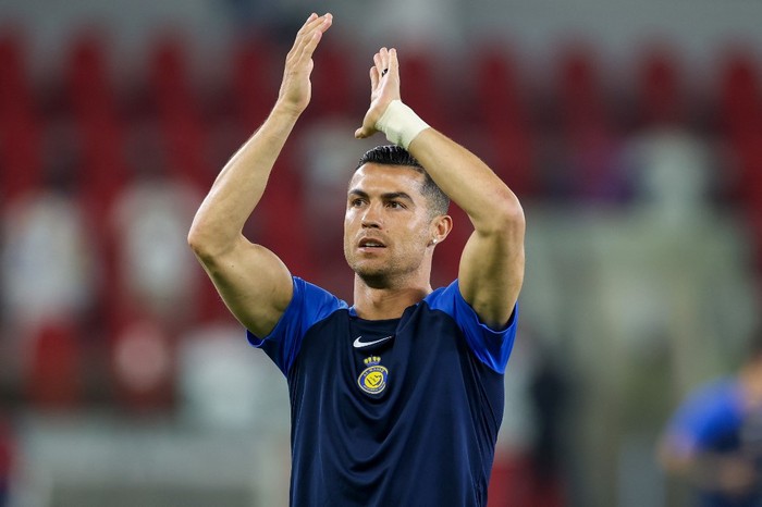 Nassrs Portuguese forward #07 Cristiano Ronaldo greets the fans ahead of the Saudi Pro League football match between Al-Ittihad and Al-Nassr at King Abdullah Sports City Stadium in Jeddah on December 26, 2023. (Photo by AFP)