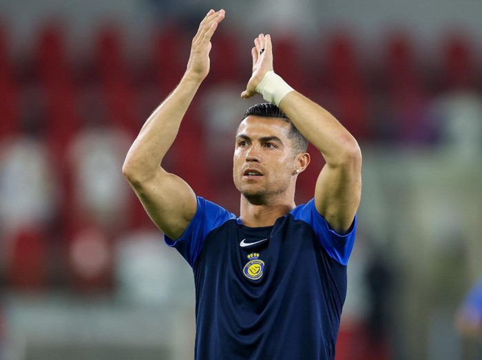 Nassr's Portuguese forward #07 Cristiano Ronaldo greets the fans ahead of the Saudi Pro League football match between Al-Ittihad and Al-Nassr at King Abdullah Sports City Stadium in Jeddah on December 26, 2023. (Photo by AFP)