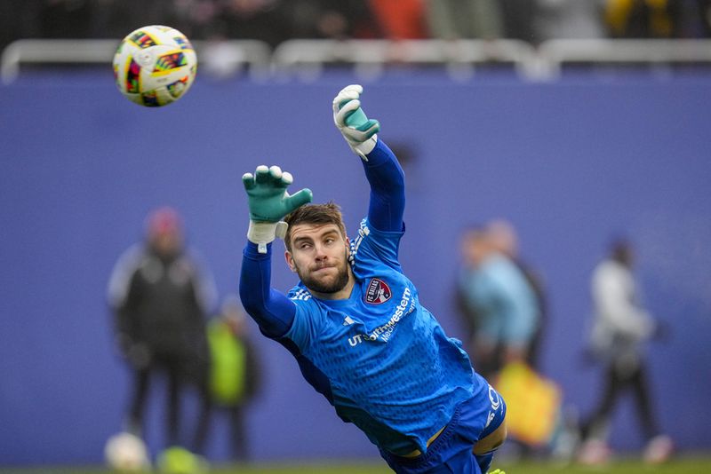 FC Dallas goalkeeper Maarten Paes dives on a shot by Inter Miami during the first half of a preseason friendly MLS soccer match Monday, Jan. 22, 2024, at the Cotton Bowl in Dallas. The shot went wide of his net. (AP Photo/Julio Cortez)