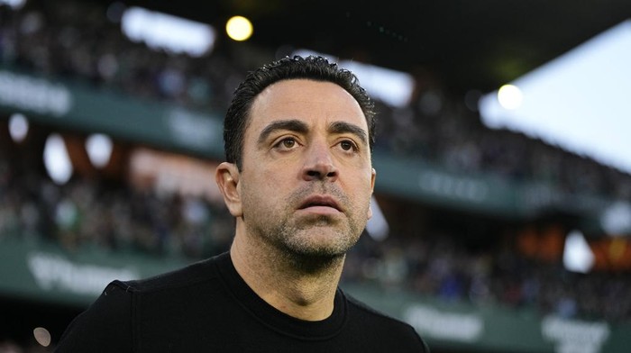 Barcelonas head coach Xavi Hernandez looks out onto the pitch before a Spanish La Liga soccer match between Betis and Barcelona at the Benito Villamarin stadium in Seville, Spain, Sunday, Jan. 21, 2024. (AP Photo/Jose Breton)