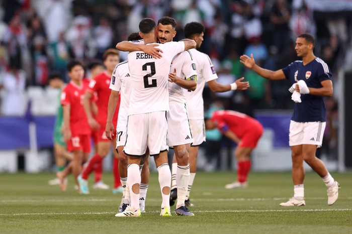 DOHA, QATAR - JANUARY 24: Rebin Solaka and Aymen Hussein of Iraq embrace after the AFC Asian Cup Group D match between Iraq and Vietnam at Jassim Bin Hamad Stadium on January 24, 2024 in Doha, Qatar. (Photo by Robert Cianflone/Getty Images)