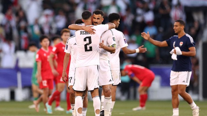 DOHA, QATAR - JANUARY 24: Rebin Solaka and Aymen Hussein of Iraq embrace after the AFC Asian Cup Group D match between Iraq and Vietnam at Jassim Bin Hamad Stadium on January 24, 2024 in Doha, Qatar. (Photo by Robert Cianflone/Getty Images)