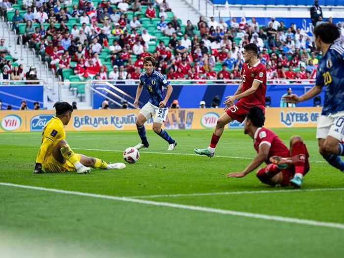 DOHA, QATAR - JANUARY 24:  of Japan scores his team's second goal during the AFC Asian Cup Group D match between Japan and Indonesia at Al Thumama Stadium on January 24, 2024 in Doha, Qatar. (Photo by Markus Gilliar - GES Sportfoto/Getty Images)