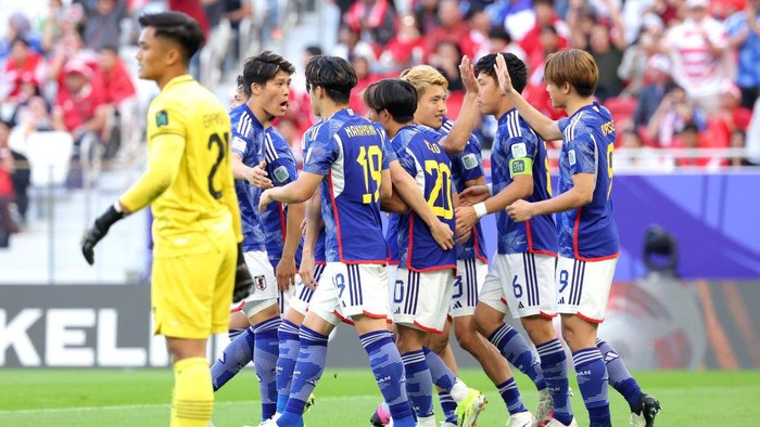 DOHA, QATAR - JANUARY 24: Ayase Ueda of Japan celebrates scoring his teams first goal with team mates during the AFC Asian Cup Group D match between Japan and Indonesia at Al Thumama Stadium on January 24, 2024 in Doha, Qatar. (Photo by Lintao Zhang/Getty Images)