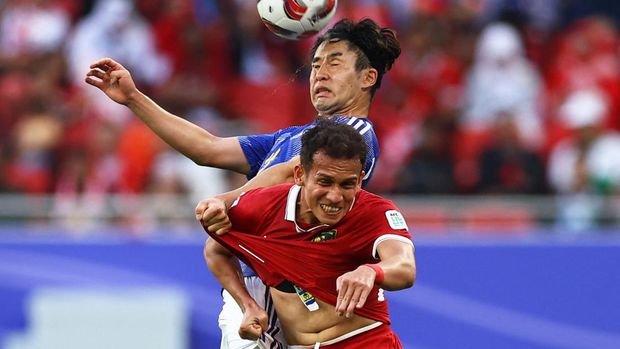 Soccer Football - AFC Asian Cup - Group D - Japan v Indonesia - Al Thumama Stadium, Doha, Qatar - January 24, 2024 Japan's Yuta Nakayama in action with Indonesia's Egy Maulana Vikri REUTERS/Molly Darlington