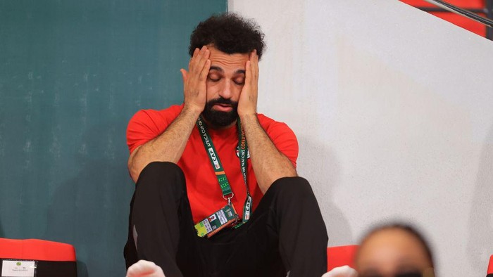 ABIDJAN, IVORY COAST - JANUARY 22: Mohammed Salah of Egypt gestures as he follows the Africa Cup of Nations Group B match between Cape Verde and Egpyt from the bench at Felix Houphouet Boigny Stadium in Abidjan, Ivory Coast on January 22, 2024. (Photo by Fareed Kotb/Anadolu via Getty Images)