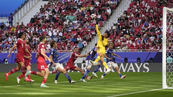 Indonesia's goalkeeper Ernando Ari Sutaryadi saves a ball during the Asian Cup Group D soccer match between Japan and Indonesia at Al Thumama in Doha, Qatar, Wednesday, Jan. 24, 2024. (AP Photo/Thanassis Stavrakis)