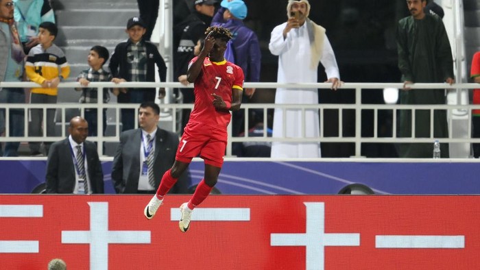 DOHA, QATAR - JANUARY 25: Joel Kojo of Kyrgyzstan celebrates scoring his team's first goal during the AFC Asian Cup Group F match between Kyrgyzstan and Oman at Abdullah Bin Khalifa Stadium on January 25, 2024 in Doha, Qatar. (Photo by Adam Nurkiewicz/Getty Images)