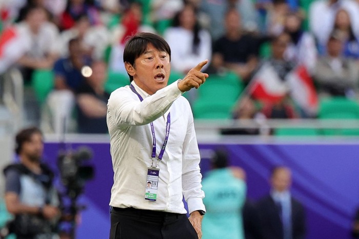 Indonesias South Korean coach Shin Tae-yong gestures during the Qatar 2023 AFC Asian Cup Group D football match between Japan and Indonesia at al-Thumama Stadium in Doha on January 24, 2024. (Photo by Giuseppe CACACE / AFP) / The erroneous mention[s] appearing in the metadata of this photo by Giuseppe CACACE has been modified in AFP systems in the following manner: [Indonesias South Korean coach Shin Tae-yong] instead of [Japans coach Hajime Moriyasu]. Please immediately remove the erroneous mention[s] from all your online services and delete it (them) from your servers. If you have been authorized by AFP to distribute it (them) to third parties, please ensure that the same actions are carried out by them. Failure to promptly comply with these instructions will entail liability on your part for any continued or post notification usage. Therefore we thank you very much for all your attention and prompt action. We are sorry for the inconvenience this notification may cause and remain at your disposal for any further information you may require.