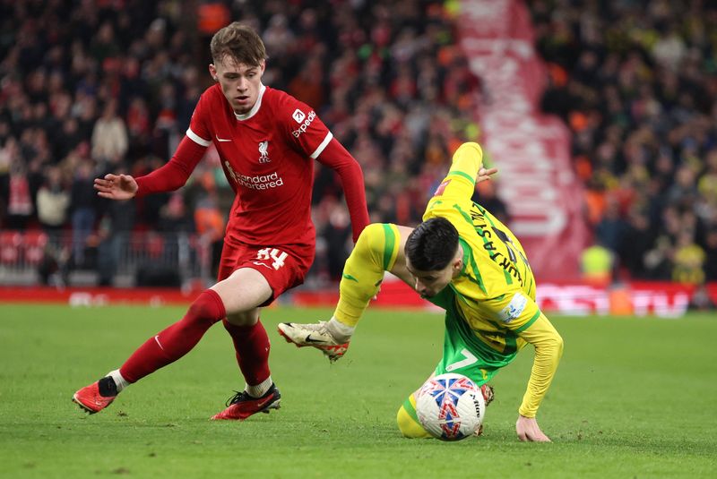 Soccer Football -  FA Cup - Fourth Round - Liverpool v Norwich City - Anfield, Liverpool, Britain - January 28, 2024 Liverpool's Conor Bradley in action with Norwich City's Borja Sainz REUTERS/Phil Noble