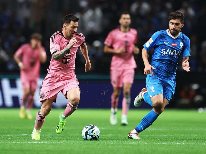 RIYADH, SAUDI ARABIA - JANUARY 29: Lionel Messi of Inter Miami battles for possession with Ruben Neves of Al Hilal during the Riyadh Season Cup match between Al Hilal and Inter Miami at Kingdom Arena on January 29, 2024 in Riyadh, Saudi Arabia. (Photo by Francois Nel/Getty Images)
