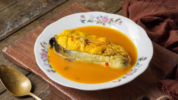 Silver catfish cooked with spicy coconut milk and fermented durian. A traditional Malay dish is known as Ikan Patin Masak Lemak Tempoyak