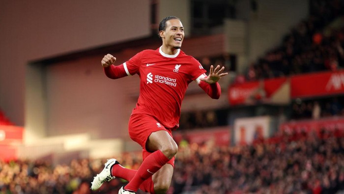 LIVERPOOL, ENGLAND - JANUARY 28: Virgil van Dijk of Liverpool celebrates scoring his teams fourth goal during the Emirates FA Cup Fourth Round match between Liverpool and Norwich City at Anfield on January 28, 2024 in Liverpool, England. (Photo by Clive Brunskill/Getty Images)