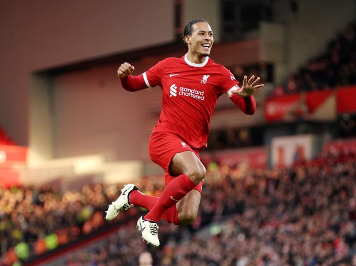 LIVERPOOL, ENGLAND - JANUARY 28: Virgil van Dijk of Liverpool celebrates scoring his team's fourth goal during the Emirates FA Cup Fourth Round match between Liverpool and Norwich City at Anfield on January 28, 2024 in Liverpool, England. (Photo by Clive Brunskill/Getty Images)