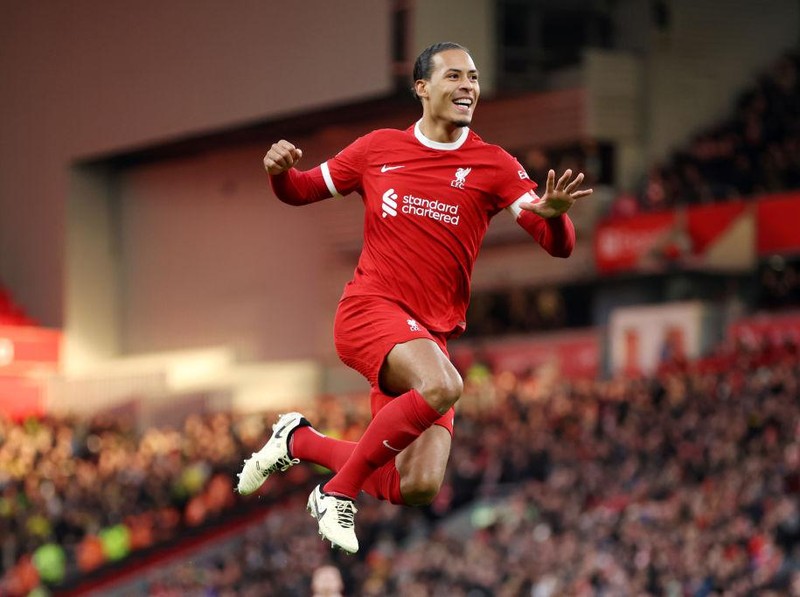 LIVERPOOL, ENGLAND - JANUARY 28: Virgil van Dijk of Liverpool celebrates scoring his team's fourth goal during the Emirates FA Cup Fourth Round match between Liverpool and Norwich City at Anfield on January 28, 2024 in Liverpool, England. (Photo by Clive Brunskill/Getty Images)
