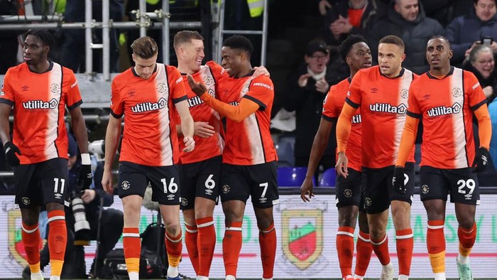 LUTON, ENGLAND - JANUARY 30: Chiedozie Ogbene of Luton Town celebrates scoring his teams second goal with teammate Ross Barkley during the Premier League match between Luton Town and Brighton & Hove Albion at Kenilworth Road on January 30, 2024 in Luton, England. (Photo by Alex Pantling/Getty Images)