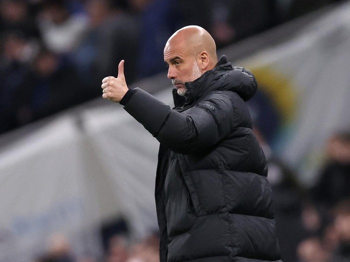 Soccer Football -  FA Cup - Fourth Round - Tottenham Hotspur v Manchester City - Tottenham Hotspur Stadium, London, Britain - January 26, 2024  Manchester City manager Pep Guardiola reacts REUTERS/David Klein