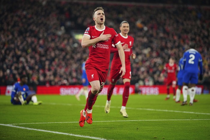 Liverpools Diogo Jota celebrates after scoring his sides first goal during the English Premier League soccer match between Liverpool and Chelsea, at Anfield Stadium, Liverpool, England, Wednesday, Jan.31, 2024. (AP Photo/Jon Super)