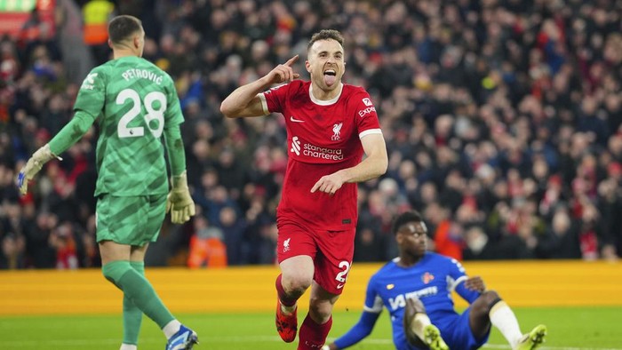 Liverpools Diogo Jota celebrates after scoring his sides first goal during the English Premier League soccer match between Liverpool and Chelsea, at Anfield Stadium, Liverpool, England, Wednesday, Jan.31, 2024. (AP Photo/Jon Super)