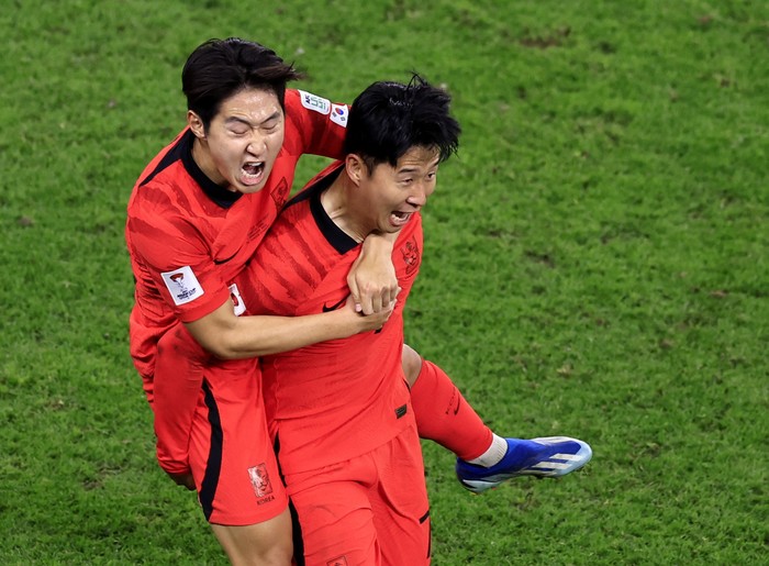 Soccer Football - AFC Asian Cup - Quarter Final - Australia v South Korea - Al Janoub Stadium, Al Wakrah, Qatar - February 2, 2024 South Koreas Son Heung-Min celebrates scoring their second goal with Lee Kang-In REUTERS/Thaier Al-Sudani