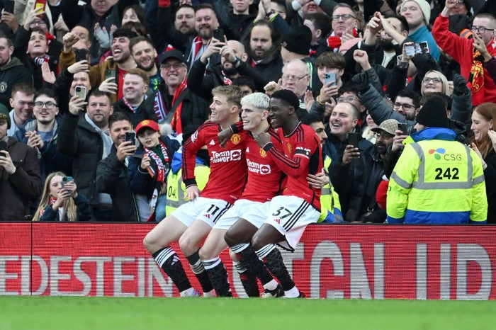 MANCHESTER, ENGLAND - FEBRUARY 04: Alejandro Garnacho of Manchester United celebrates with Rasmus Hojlund and Kobbie Mainoo of Manchester United after scoring his team's second goal during the Premier League match between Manchester United and West Ham United at Old Trafford on February 04, 2024 in Manchester, England. (Photo by Michael Regan/Getty Images)