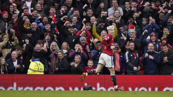 Manchester Uniteds Alejandro Garnacho celebrates after scoring his sides third goal during the English Premier League soccer match between Manchester United and West Ham United at the Old Trafford stadium in Manchester, England, Sunday, Feb. 4, 2024. (AP Photo/Dave Thompson)
