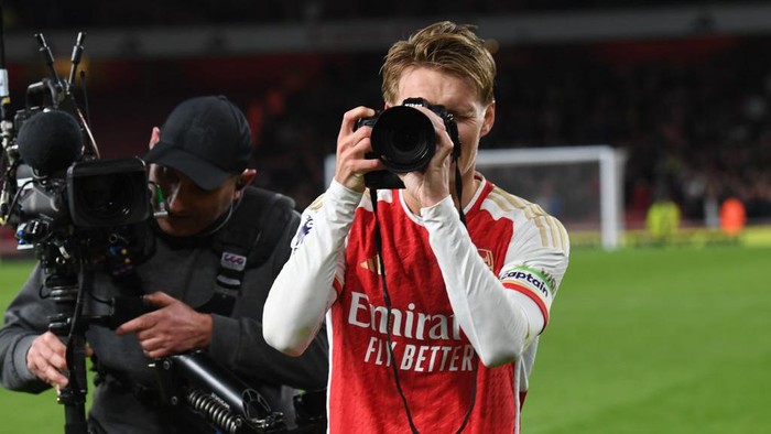 LONDON, ENGLAND - FEBRUARY 04: Arsenal captain Martin Odegaard takes pictures after the Premier League match between Arsenal FC and Liverpool FC at Emirates Stadium on February 04, 2024 in London, England. (Photo by Stuart MacFarlane/Arsenal FC via Getty Images)