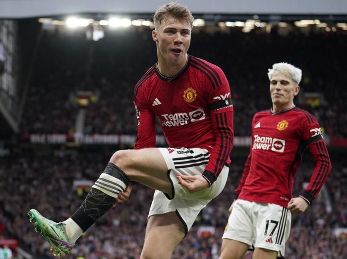 Manchester United's Rasmus Hojlund celebrates after scoring his side's first goal during the English Premier League soccer match between Manchester United and West Ham United at the Old Trafford stadium in Manchester, England, Sunday, Feb. 4, 2024. (AP Photo/Dave Thompson)