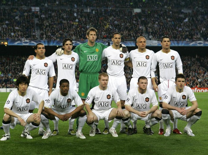 Manchester United team pose prior to the Champions League semifinal, first leg, against FC Barcelona at the Camp Nou stadium in Barcelona, Spain, Wednesday, April 23, 2008. Top row from left: Carlos Tevez, Owen Hargreaves, Edwin van der Sar, Rio Ferdinand, Wes Brown and Cristiano Ronaldo. Bottom row from left: Dong Fangzhuo, Louis Saha, Paul Scholes, Wayne Rooney, Michael Carrick.  (AP Photo/Victor R. Caivano)
